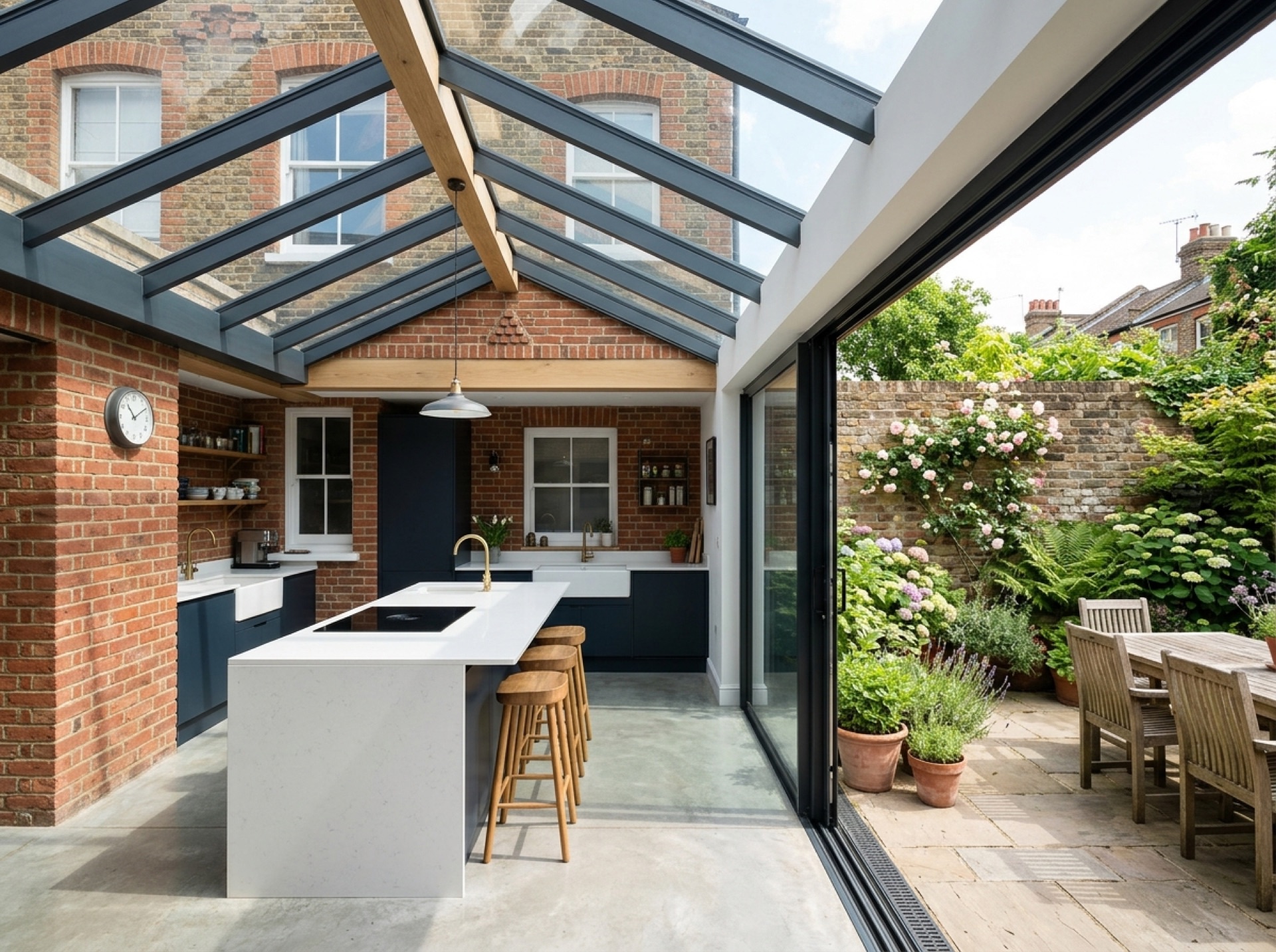 Side-return kitchen extension with a glass roof opening onto a courtyard garden